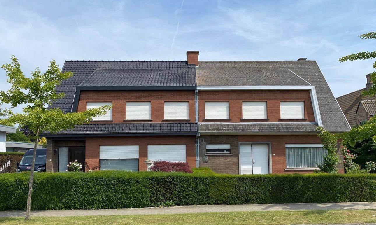 Volledig gerenoveerd hellend dak met nieuwe antracietkleurige dakpannen, gerealiseerd door De Renovatie Meesters